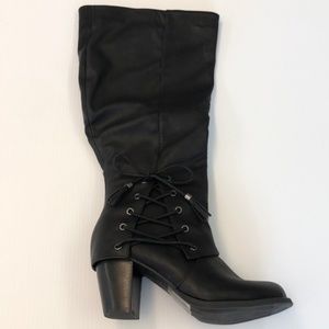 Torrid black boot with lace up tassel detailing